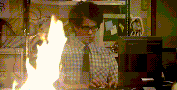 Moss from IT crowd writing an email to the authorities about the fire in his office.